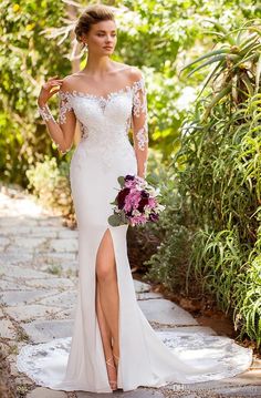 a woman in a white wedding dress holding a bouquet