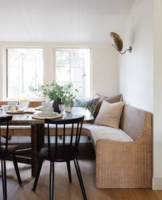 a dining room table with chairs and a couch