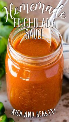 homemade enchilada sauce in a jar with a spoon