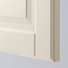 a white cabinet with two doors on each side