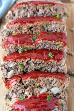 sliced meatloaf with ketchup on a cutting board