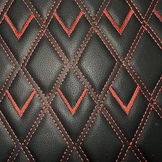 a black and red leather texture with stitching