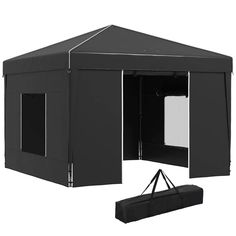 a large black tent with the door open