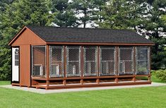 a dog kennel is shown in front of some trees