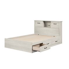 an image of a bed with drawers in it