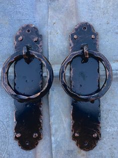 an old pair of door handles on the sidewalk