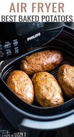 the air fryer has four baked potatoes in it