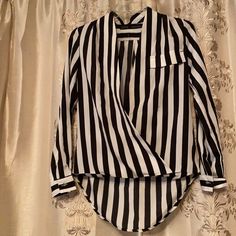 The Sexy Referee Blouse Zara Great For Spring Summer Chic And Very Jackie O Black And White Vertical Stripes Very Slimming - Size S New Without Tags Bought For Shoot Been In Storage - Circa 2011 Hits At Waist In Front Longer “Tail”In Back - Deep V Cross Over Front Super Sexy And Classy. Cotton Rayon Blend Size S Striped Long Sleeve Party Blouse, Chic Striped Tops For Night Out, Striped V-neck Blouse For Work, Chic Striped V-neck Blouse, Trendy Fitted Striped Blouse, Striped V-neck Top For Party, Striped Long Sleeve Party Top, Black V-neck Shirt For Office Wear, Chic V-neck Shirt For Night Out