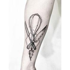 a black and white photo of a hot air balloon tattoo on the right arm with scissors in it