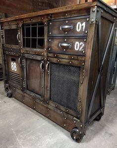 an old fashioned metal cabinet with numbers on the front and side doors, sitting in a warehouse