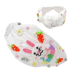 a white headband with an image of a bunny on it and a hair band