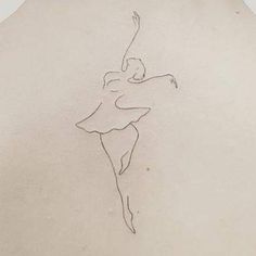 a woman's back with a drawing of a ballerina on the back of her body