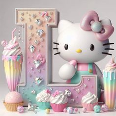 a hello kitty birthday cake and cupcakes with the letter i on it's side