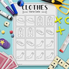 the clothes game cards are laid out on a table with toys and crayons