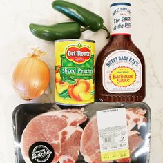 ingredients for an entree laid out on a counter with pepper, mustard, and jalapenos