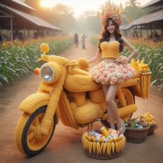 a woman in a yellow dress standing next to a motorcycle made out of corn cobs