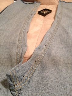 a close up of a person's shirt with buttons on it