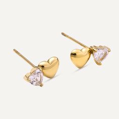 These 18K gold-plated earrings feature a charming duo of hearts, one solid gold and the other adorned with a sparkling cubic zirconia crystal. Perfect for adding a romantic touch to any outfit, these studs are a must-have accessory for both casual and special occasions. Product Code: DE1206K Collection: Vibes Type: Post Material: 18K Gold-Plated Stainless Steel Dimensions: 1cm Pendant Dimensions: Style: Dual Heart & Crystal Includes: Heart Crystal, Gold Plated Earrings, A Romantic, Earring Necklace, Ring Necklace, Post Earrings, Necklaces Bracelets, Solid Gold, Silver Gold