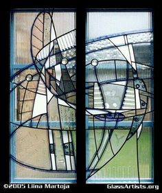 two stained glass windows with different shapes and sizes