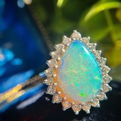 This Fine Vintage Estate Pear Opal Cocktail Ring Features A Vibrant Natural Opal Surrounded By Sparkling Natural Round Brilliant Diamonds Crafted In 14k White Gold. This Ring Is A Showstopper, Be Prepared To Be The Receiver Of Many Compliments! The 3.12 Carat Opal And 1.24 Carats Of Diamonds Equal An Impressive 4.36 Carats Total Weight. The Opal Has Incredible Spread Measuring 17.91x13.12x3.43 And The Ring Has Nearly An Inch Of Finger Coverage From Top To Bottom Making It A Sure To Be Noticed Statement Ring. Currently A Size 5.25+ Easily Sized. We Are Professional Jewelers. Prices Here Are Firm, We Do Not Trade - To Learn More About Heritage Jewelry Read Our Bio. This Ring Will Be Verified B Pear-shaped Opal Ring For Formal Occasions, Fine Jewelry Pear-shaped Opal Ring, Gia Certified Pear Shaped Fine Jewelry, Gia Certified Pear-shaped Fine Jewelry, Formal Pear-shaped Opal Ring, Heritage Jewellery, Diamond Cocktail Ring, Diamond Cocktail Rings, Natural Opal