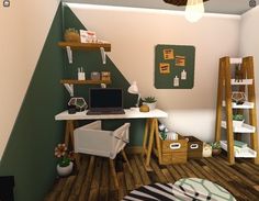 a computer desk sitting on top of a hard wood floor next to a green wall