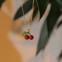 Description:Dainty Crystal Cherry Necklace Specifications:Material: stainless steel, 18k gold, crystalColors: goldSize: 45 cm + 6 cm extWeight: 2.2 g/pcs Add a sweet touch to your outfit with our Dainty Crystal Cherry Necklace. This playful pendant features a delicate cherry design adorned with sparkling crystals. Perfect for gifting or adding a fun pop of charm to your own jewelry collection. 🍒 Peach Necklace Fruit, Bead Cherry Necklace, Cherry Jewelry, قلادات متدلية, Cherry Necklace, Fruit Necklace, Pretty Jewelry Necklaces, Carnelian Necklace, Jewelry Accessories Ideas