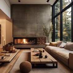 a living room filled with furniture and a fire place in the middle of it's walls