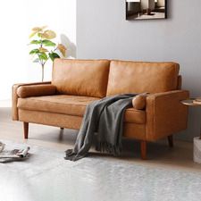 a living room with a brown leather couch