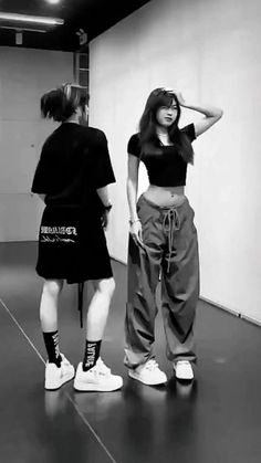 two young women standing in an empty room