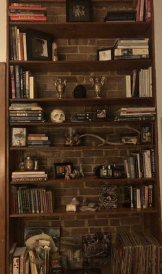 a bookshelf filled with lots of different items