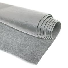 a roll of gray felt with circles on it