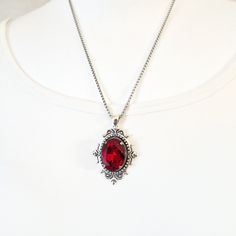 Victorian style necklace with a beautifully sized crystal cabochon for a neckline that won't go unnoticed. -------------- Details ---------------- - Oval cabochon in real faceted cut crystal: 18x25mm - Intense and vibrant colors: ... Sapphire Blue ...Pure crystal (white) ...Siam (intense red) ...Amethyst plum ... Pine green ... Black diamond (black anthracite gray) ...AB crystal (multicolor that varies with light) ... Sun (deep orange-yellow) - Medieval Victorian medallion pendant in antique sil Goth Cosplay, Proof Of Love, Red Crystal Necklace, Neckline Details, Queens Jewels, Victorian Necklace, Vampire Queen, Medallion Necklace, Antique Necklace