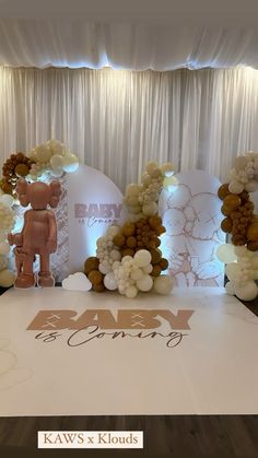 an image of a baby shower sign on the dance floor at a wedding or event