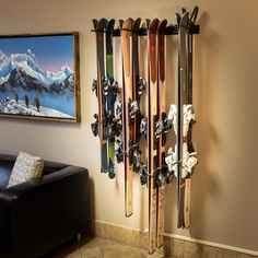 there are many skis hanging on the wall in this living room, and it's easy to use