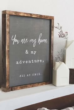 a sign that says you are my home and my adventures all at once on a mantle