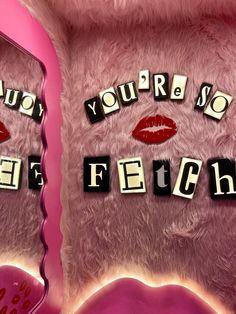 a pink teddy bear with the words you're so fierce spelled on its chest