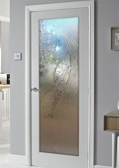 a white door with frosted glass on it