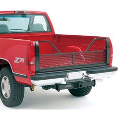 a red pick up truck parked on top of a white floor