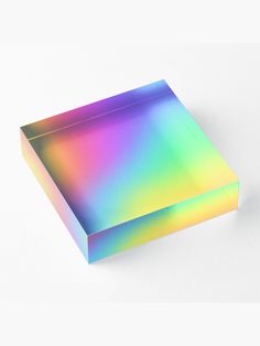 a multicolored box sitting on top of a white surface