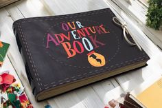 an open book with the words our adventure book on it