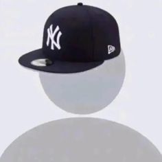 a new york yankees cap is shown on a white background with shadow from the ball