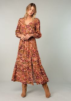 An ultra-flowy long sleeve bohemian maxi dress in a vintage-inspired clay red floral print. Designed in Los Angeles, California. Shop beautiful bohemian dresses here! Brown V-neck Maxi Dress With Floral Print, Brown Floral Print V-neck Maxi Dress, Brown Long Sleeve Maxi Dress With Boho Print, Long Sleeve Brown Maxi Dress With Boho Print, Long Fall Dresses, Long Flowy Skirt, Bohemian Dresses, Maxi Dresses Fall, Voluminous Sleeves