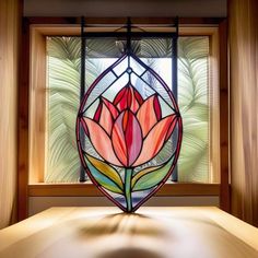 a stained glass window with a flower on it