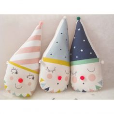 three small stuffed animals wearing party hats