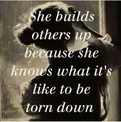 a black and white photo with the words she build others up because she knows what it's like to be torn down