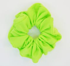 Regular sized Neon Green Lime Fluorescent scrunchie hair tie. The color is eye-catching, and it can be used to stand out in a crowd. This is one of my favorites if I want a pop of color with my outfit. This scrunchie offers more support than a traditional hair tie and wraps around most hair types 2 times.  If you are looking for more sizes or patterns, please check out our other items at littlebitsofheartco.etsy.com Everything you purchase from our shop is handmade with heart. Thank you so much for visiting and supporting our small business! Green Scrunchie, Zumba Outfit, Scrunchie Hair, Tie Gifts, Scrunchie Hairstyles, Hair Tie, Hair Types, Neon Green, Hair Ties