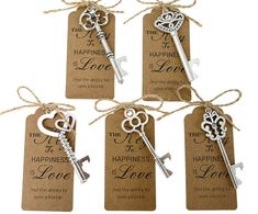 four key tags with the words happiness is love and two keys attached to each tag