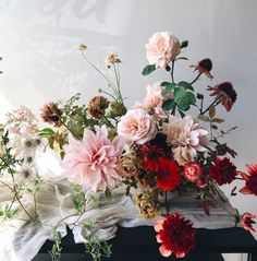 a bunch of flowers that are sitting on a table