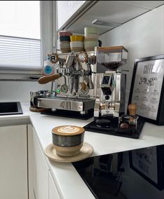 an espresso machine sitting on top of a counter