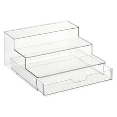 three clear drawers are stacked on top of each other